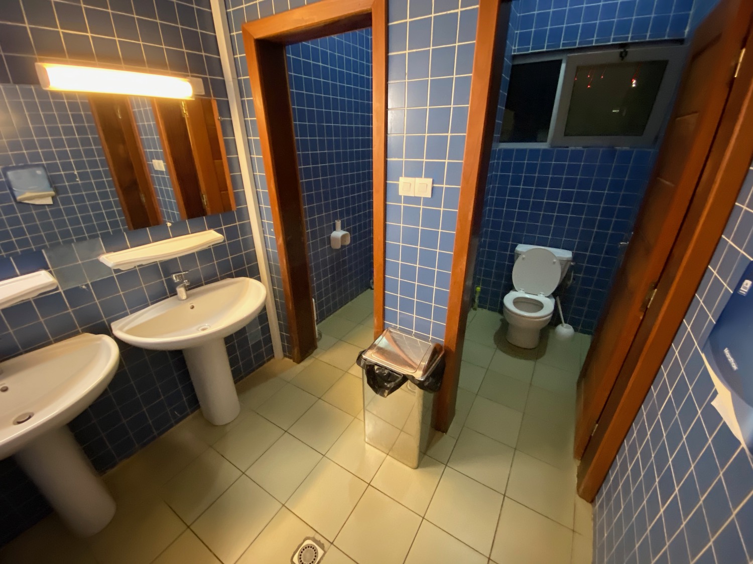 a bathroom with blue tiles