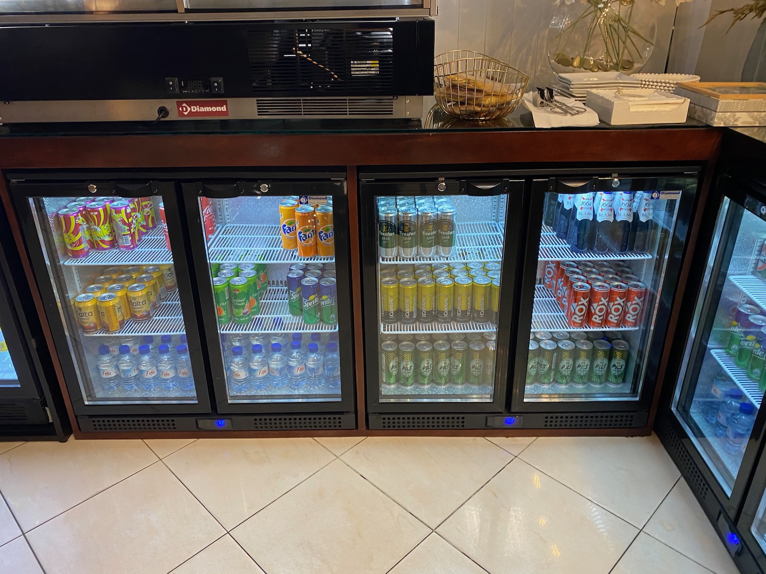 a refrigerator with drinks on the shelves