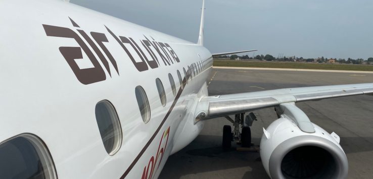 a white airplane on the tarmac