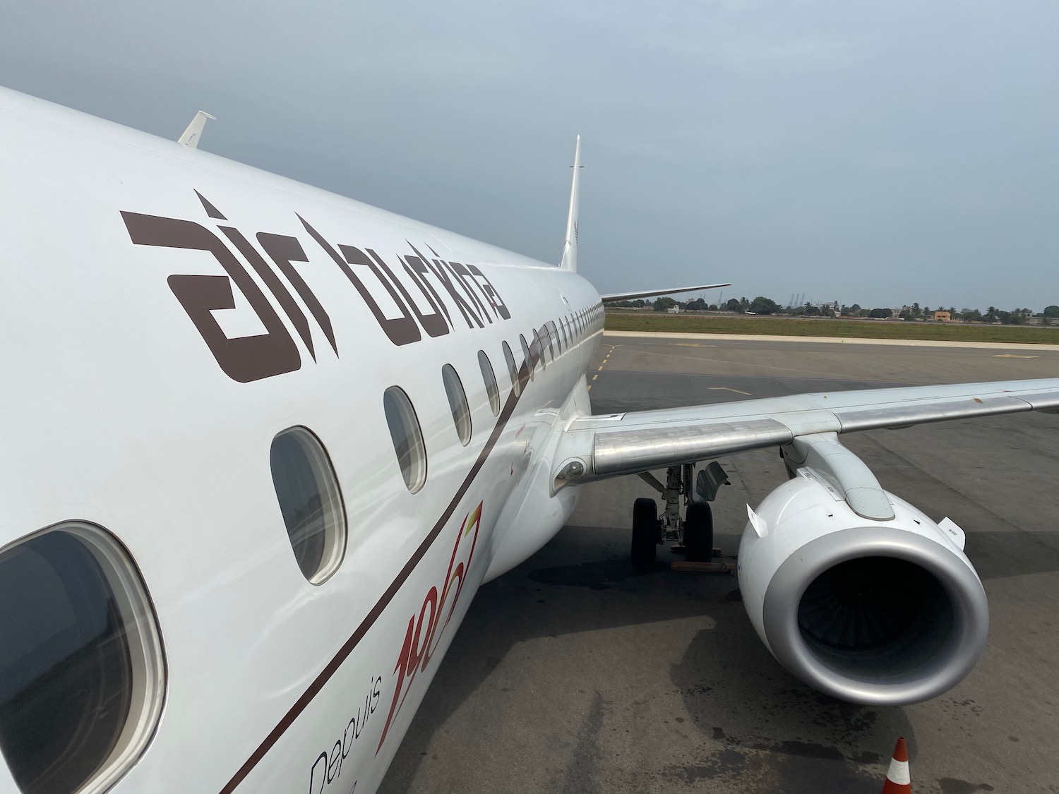 a white airplane on the tarmac