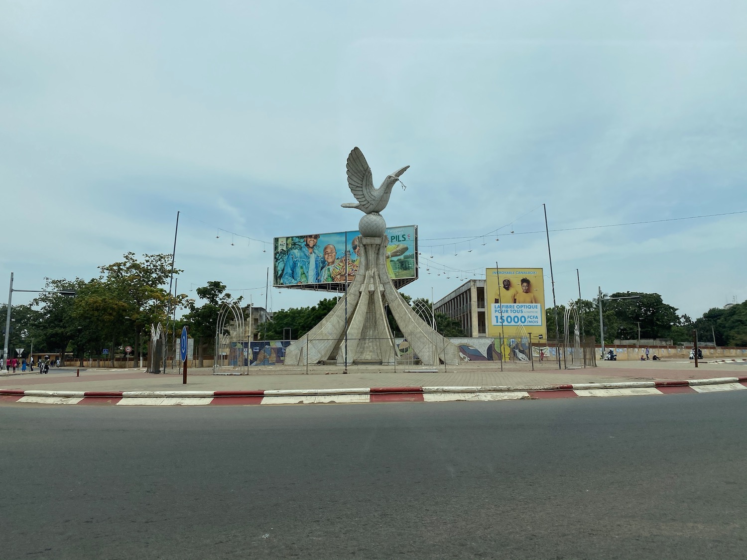 a statue of a bird on a pedestal