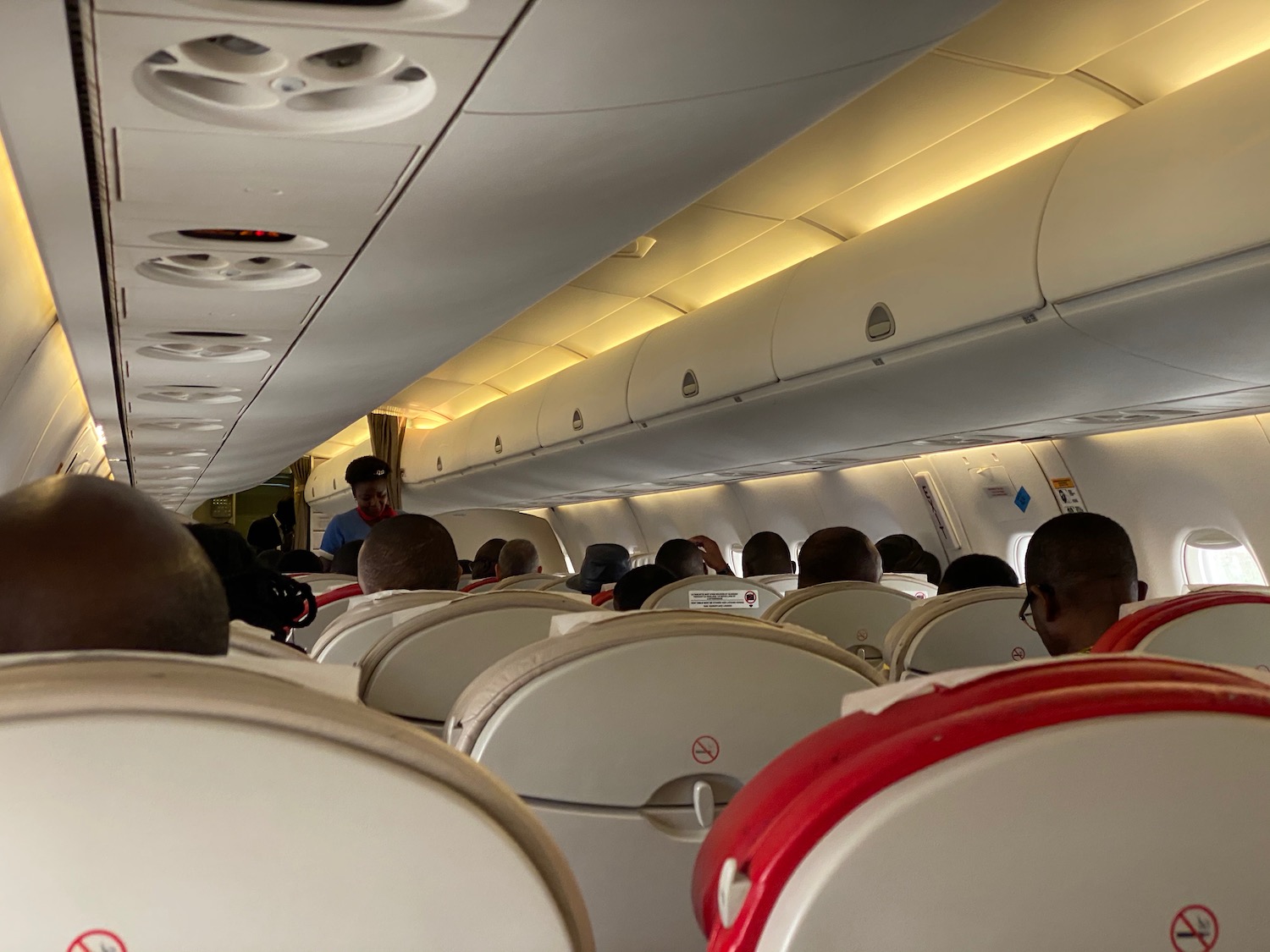 a group of people sitting in an airplane