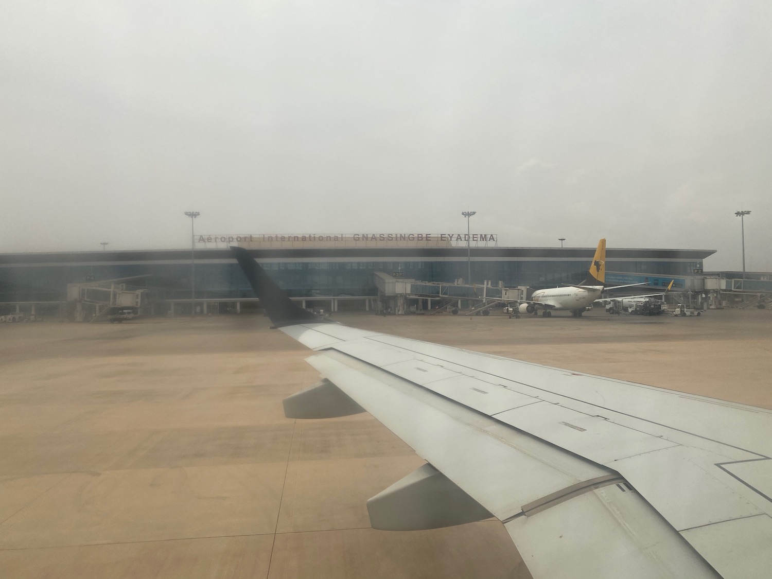 an airplane wing in front of a building