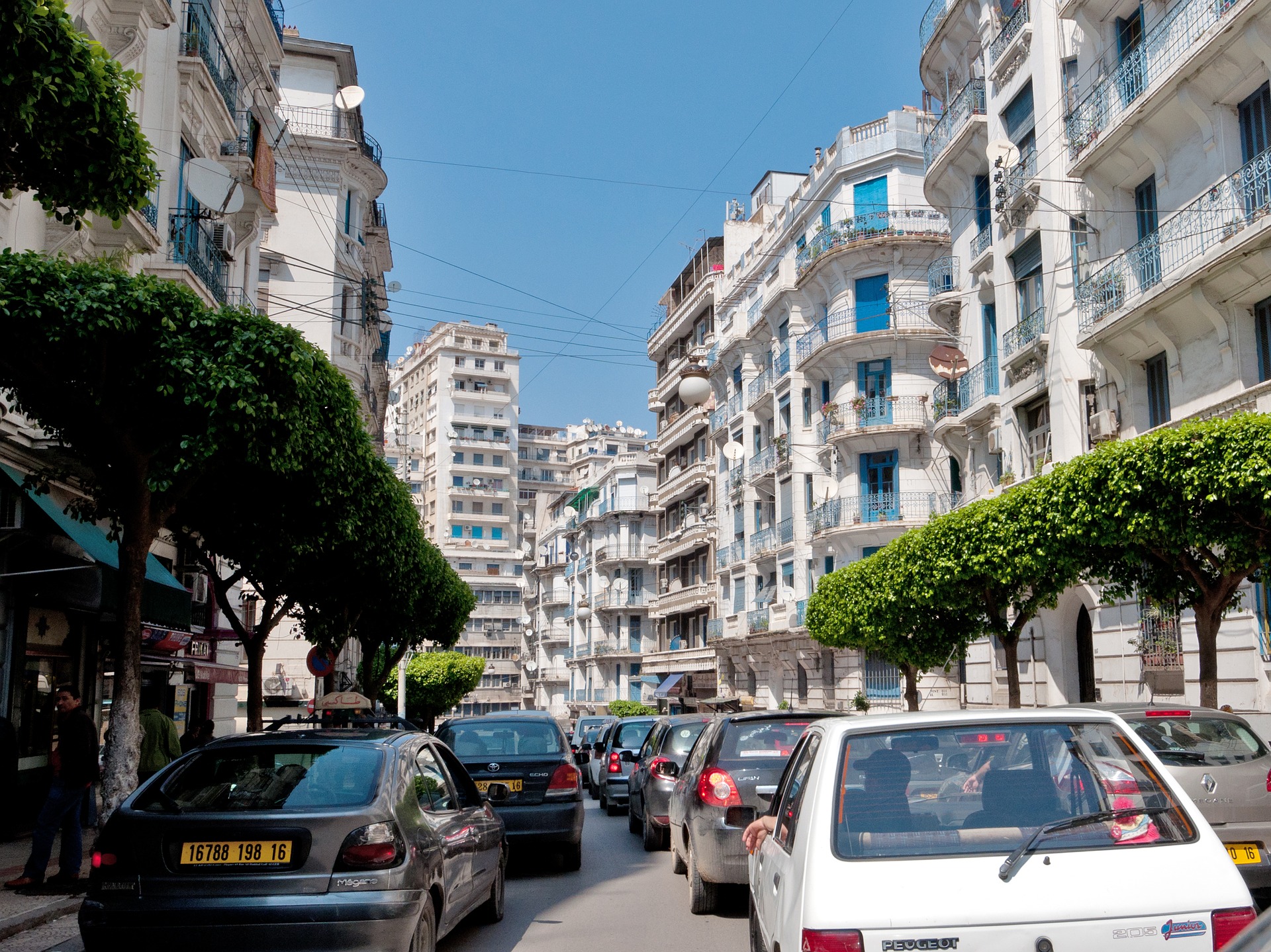 cars parked cars on a street in a city