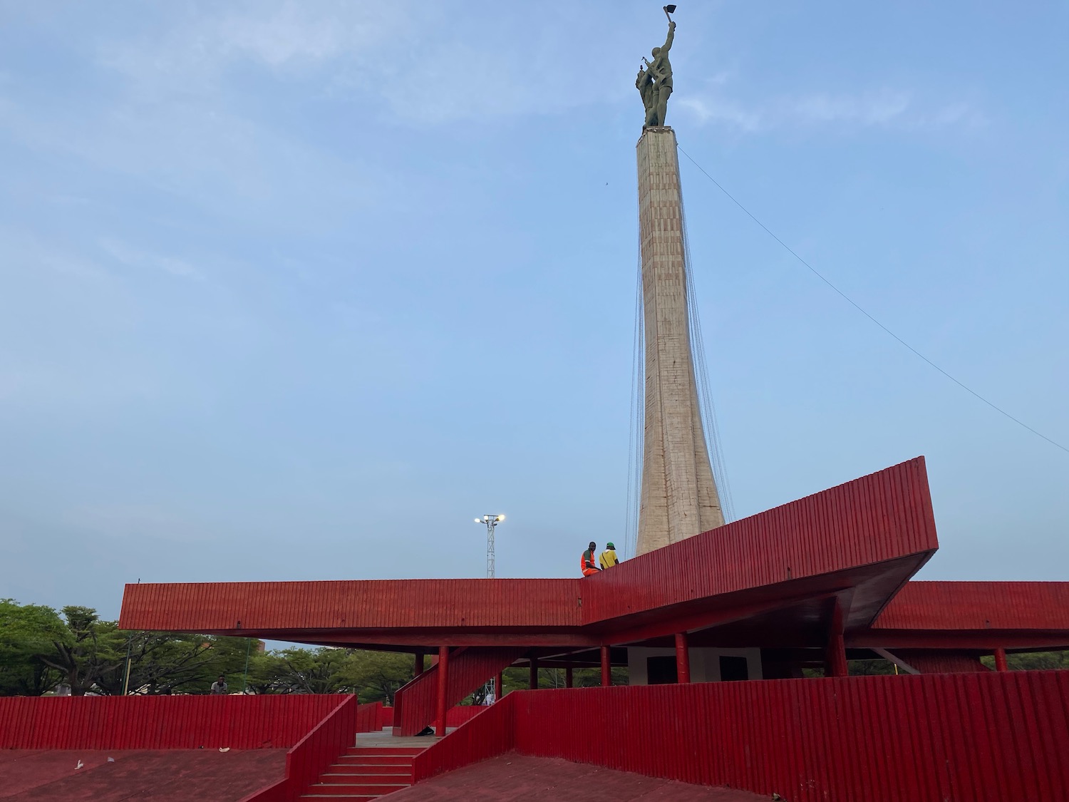 a monument with a statue on top of it