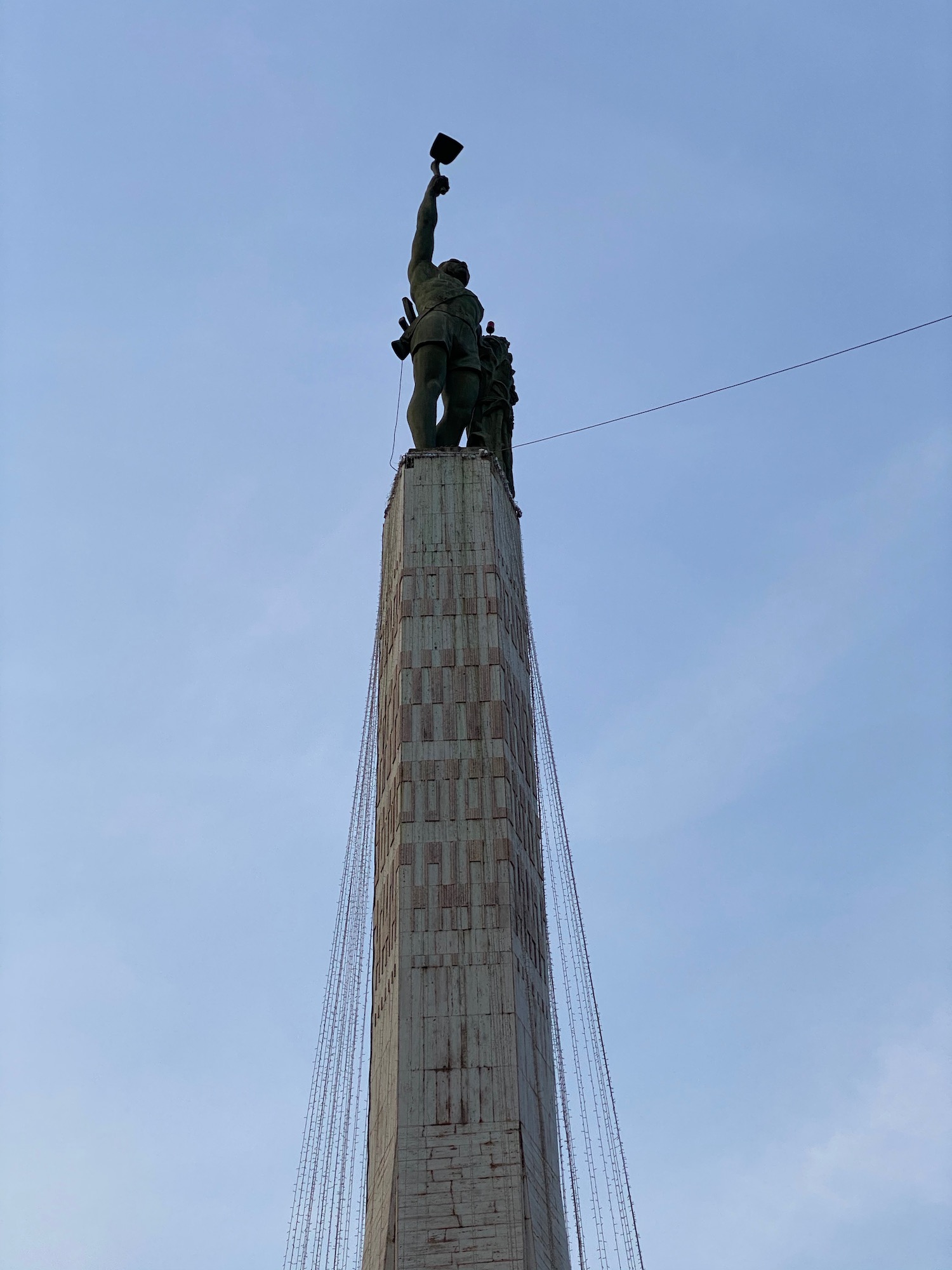 a statue on top of a tall tower