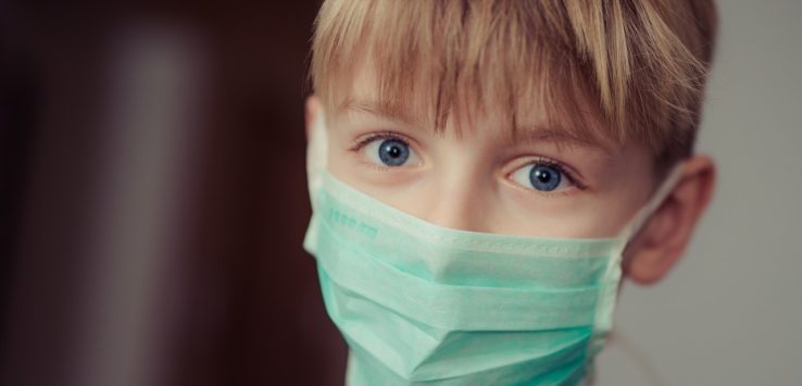 a boy wearing a mask