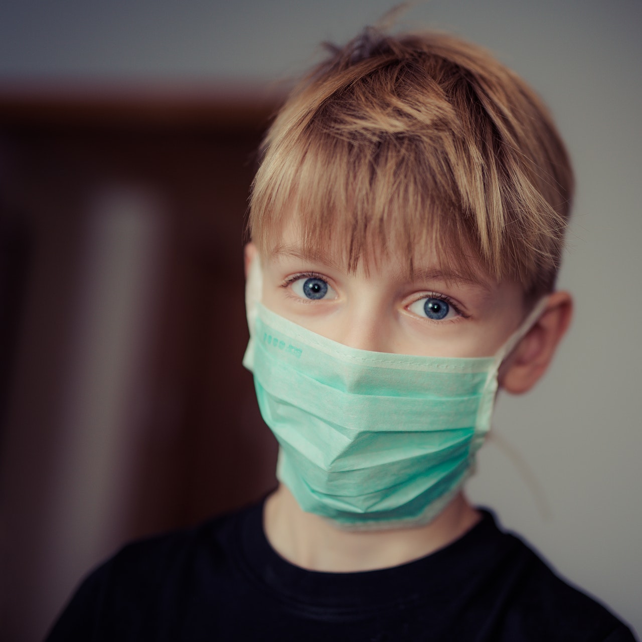 a boy wearing a mask