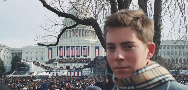 a man standing in front of a large crowd of people