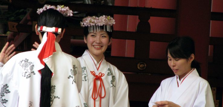 a group of women in white robes