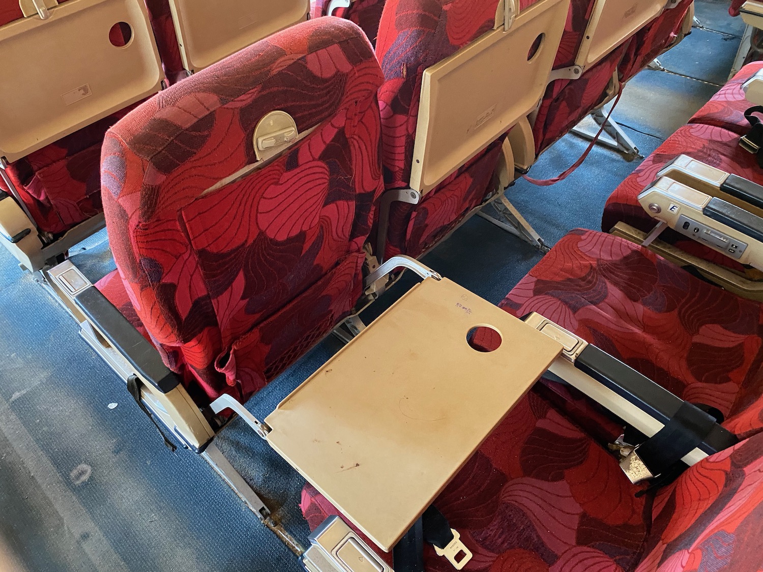 a red and black chairs with a table