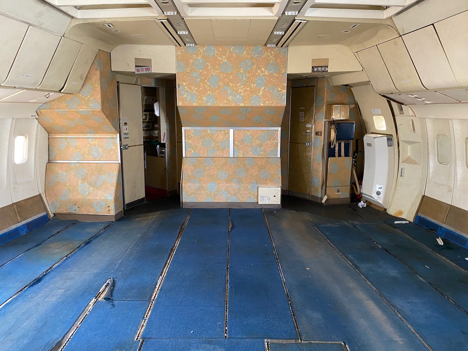 inside an airplane with blue flooring