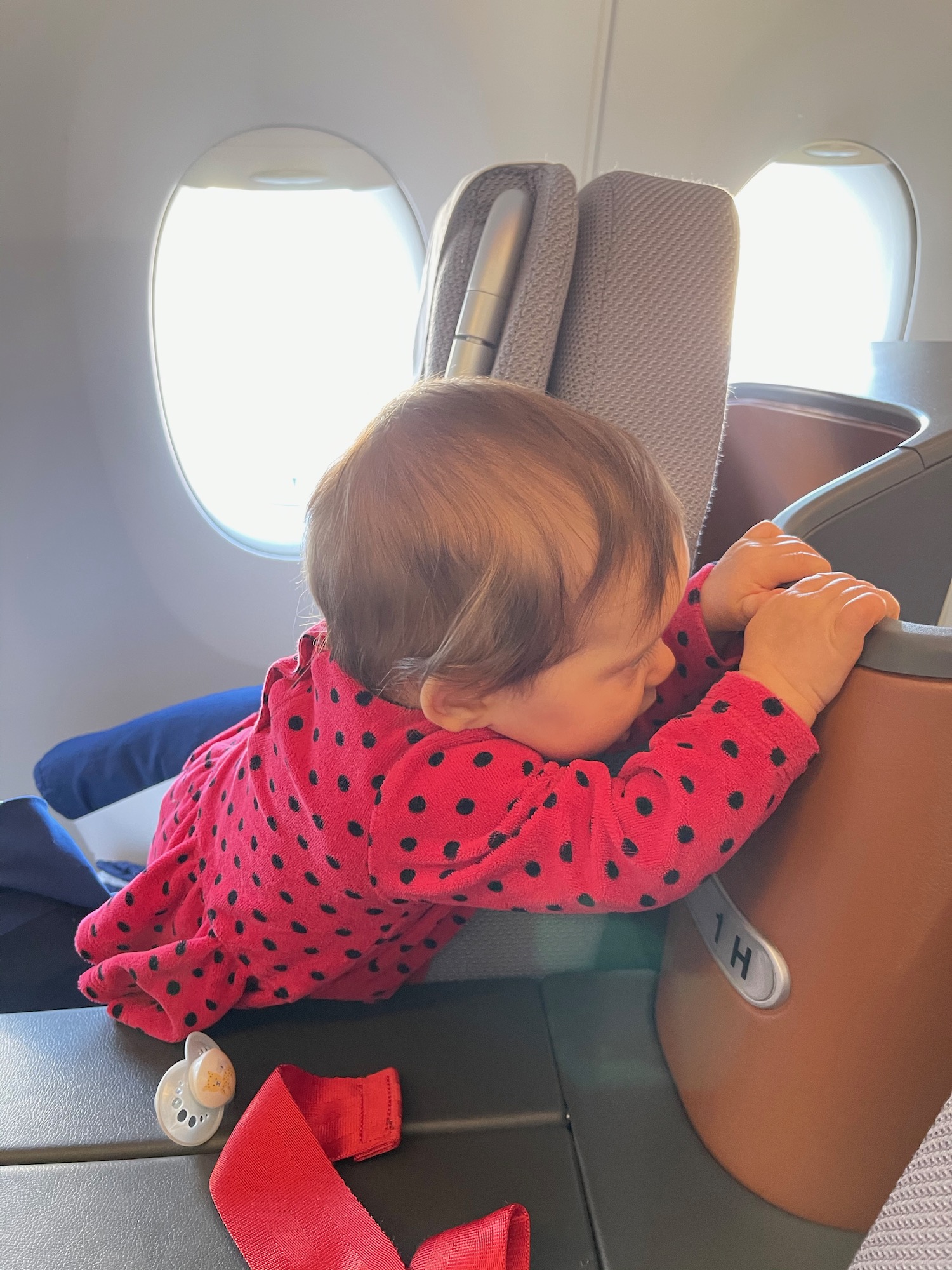 a baby in a red dress