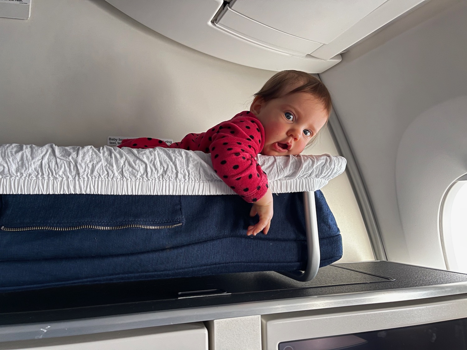 a baby lying on top of a bed