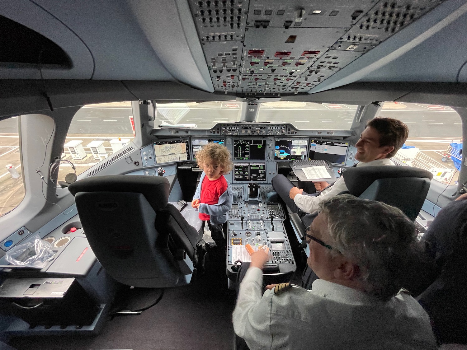 a group of people in an airplane cockpit