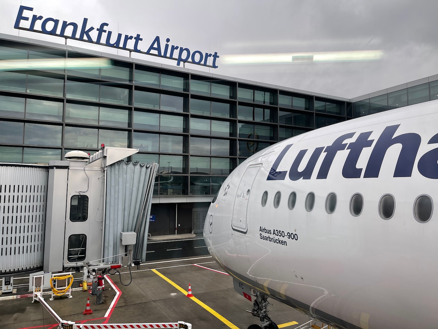 a plane parked in front of a building