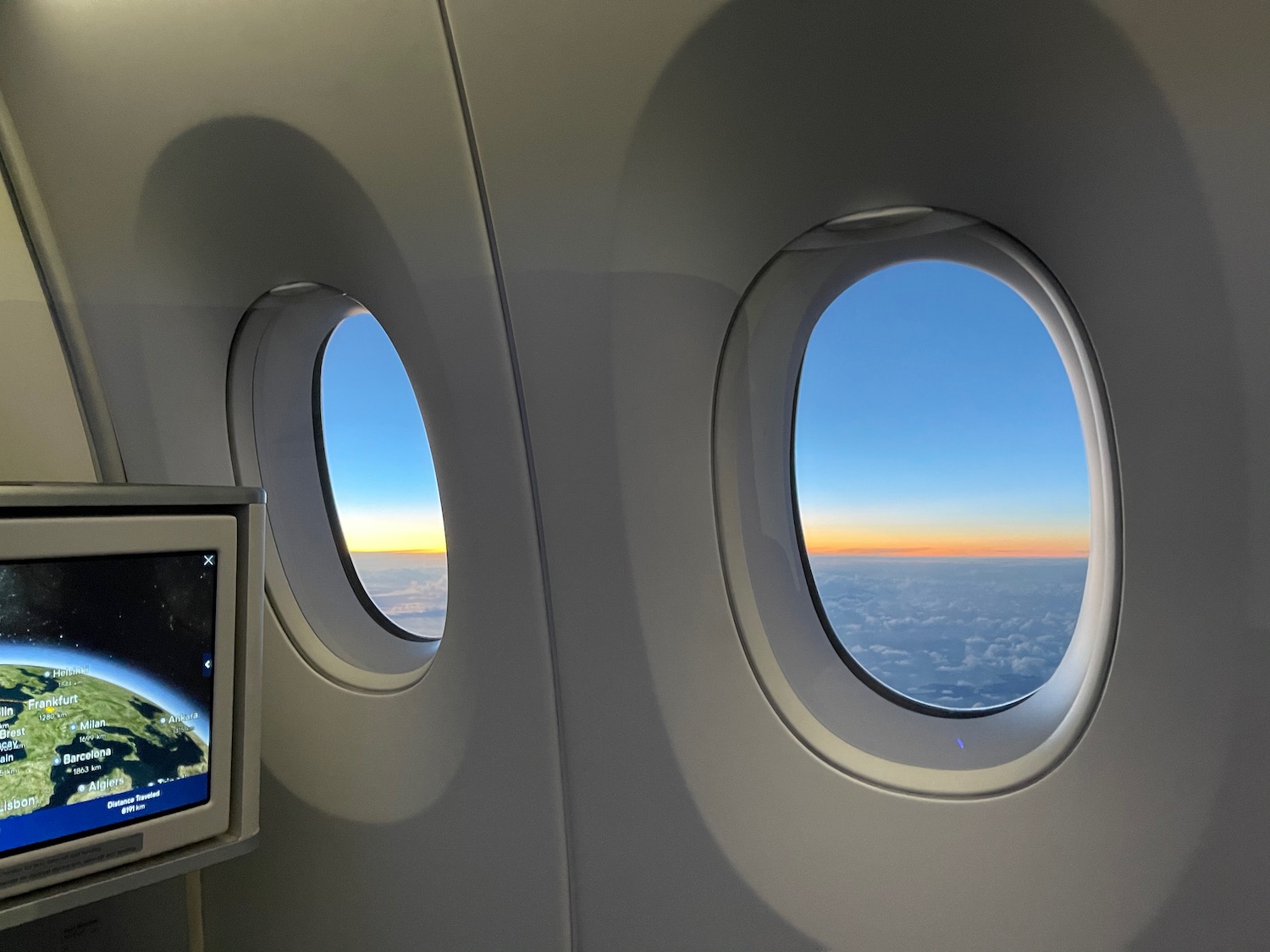 windows of an airplane with a television and a monitor