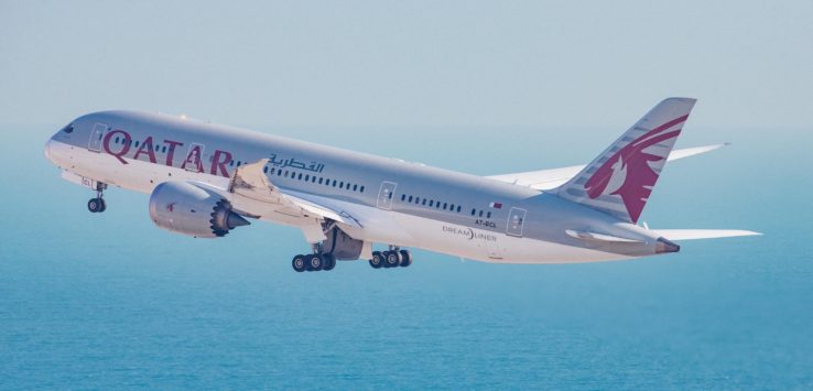 a plane flying over the water