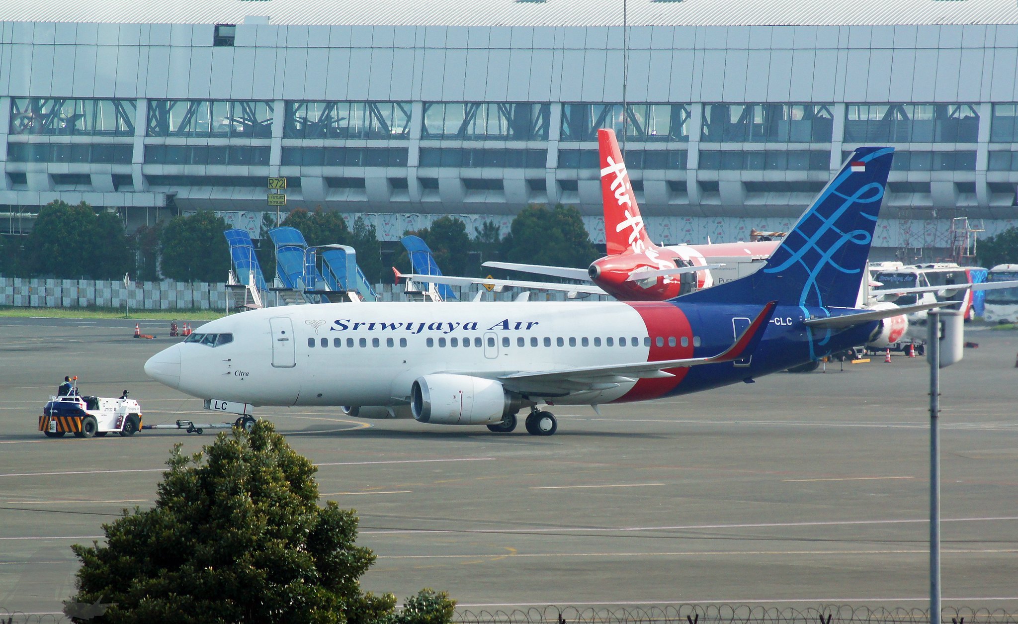 a group of airplanes on a runway