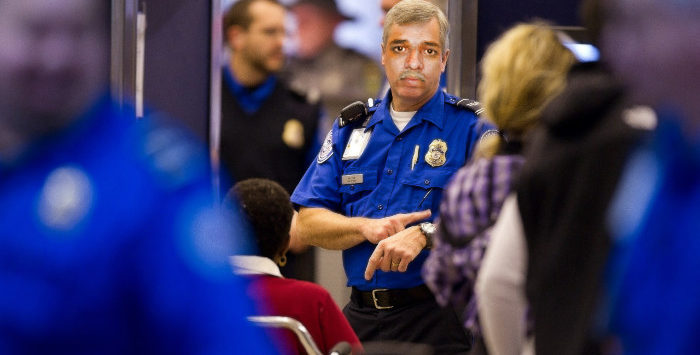 a police officer pointing at a crowd