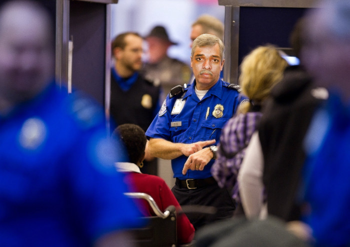 a police officer pointing at a crowd