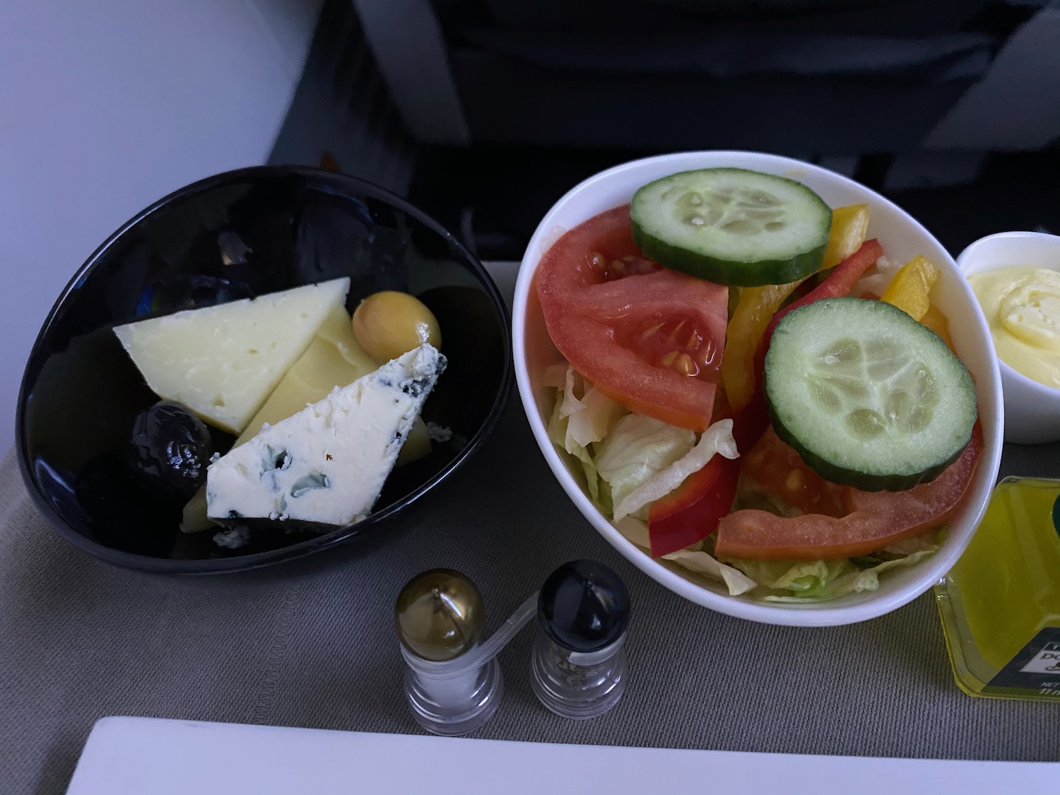 a bowl of salad and cheese