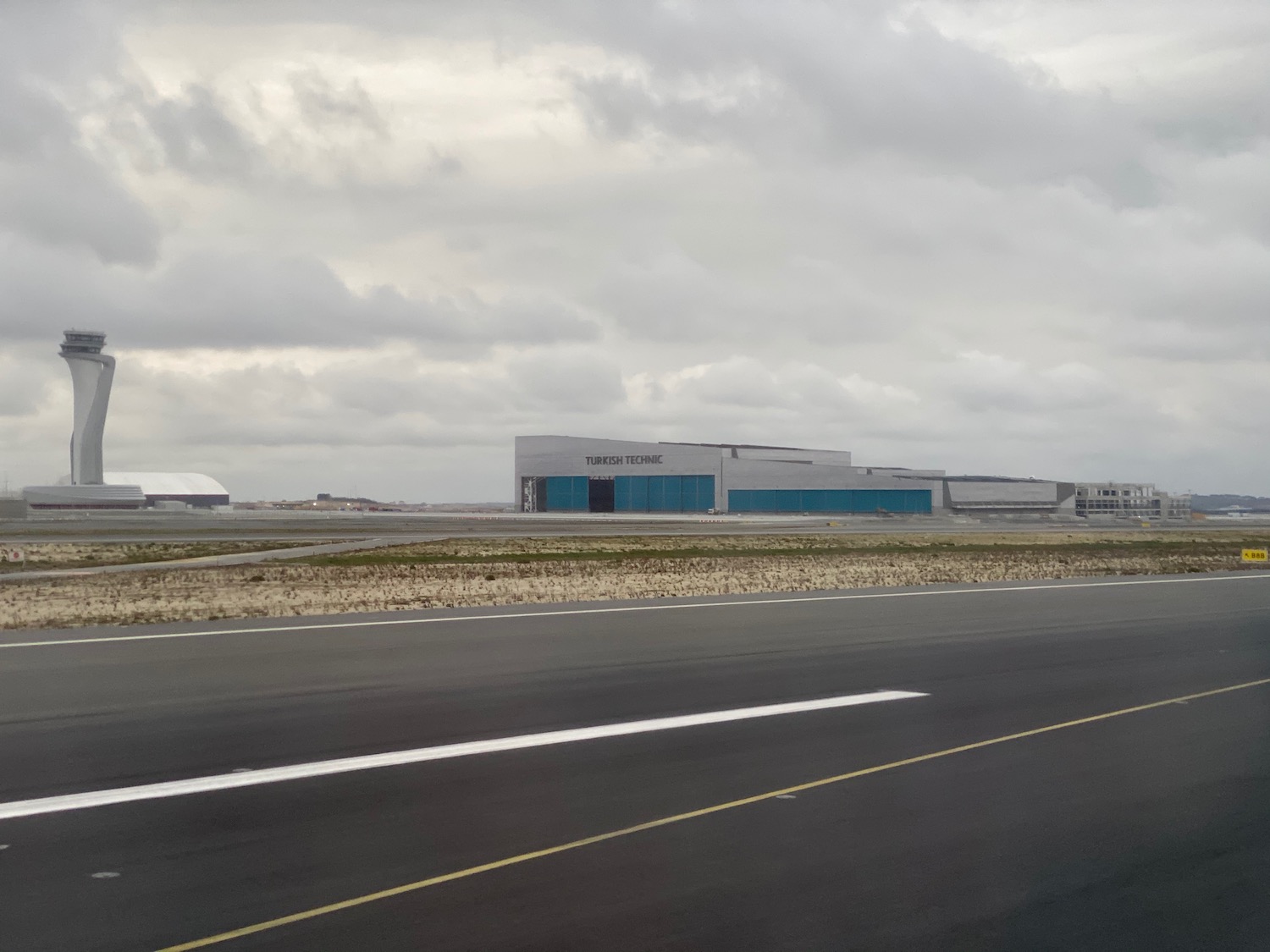 a road with a building in the distance