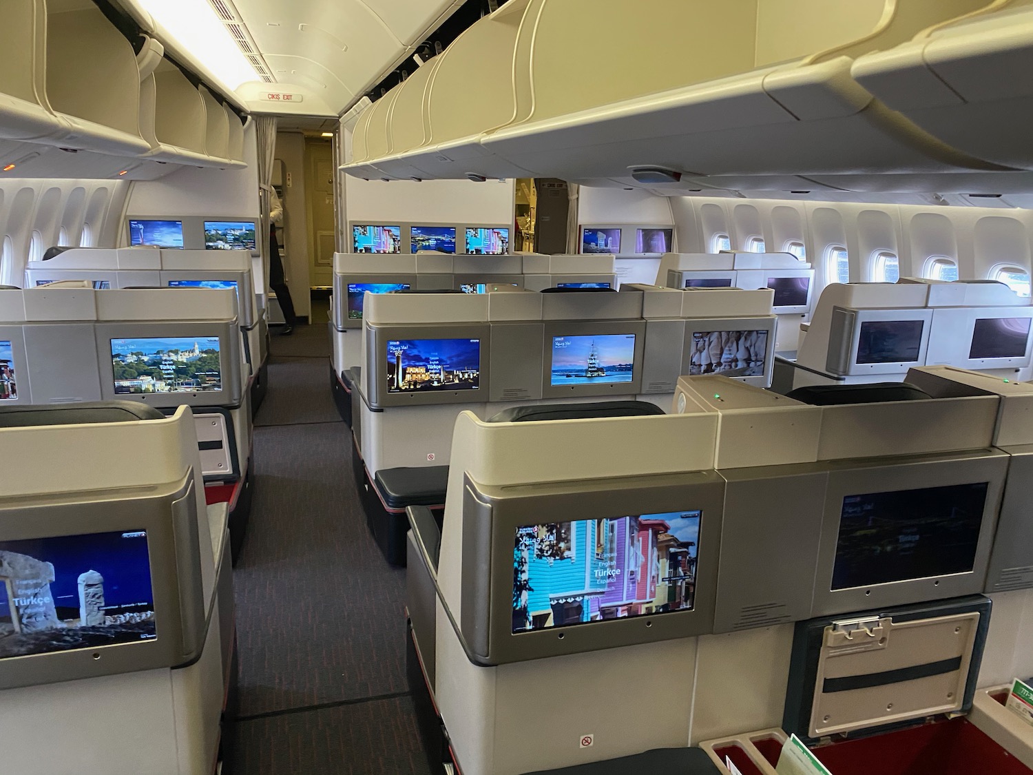 a row of monitors on an airplane