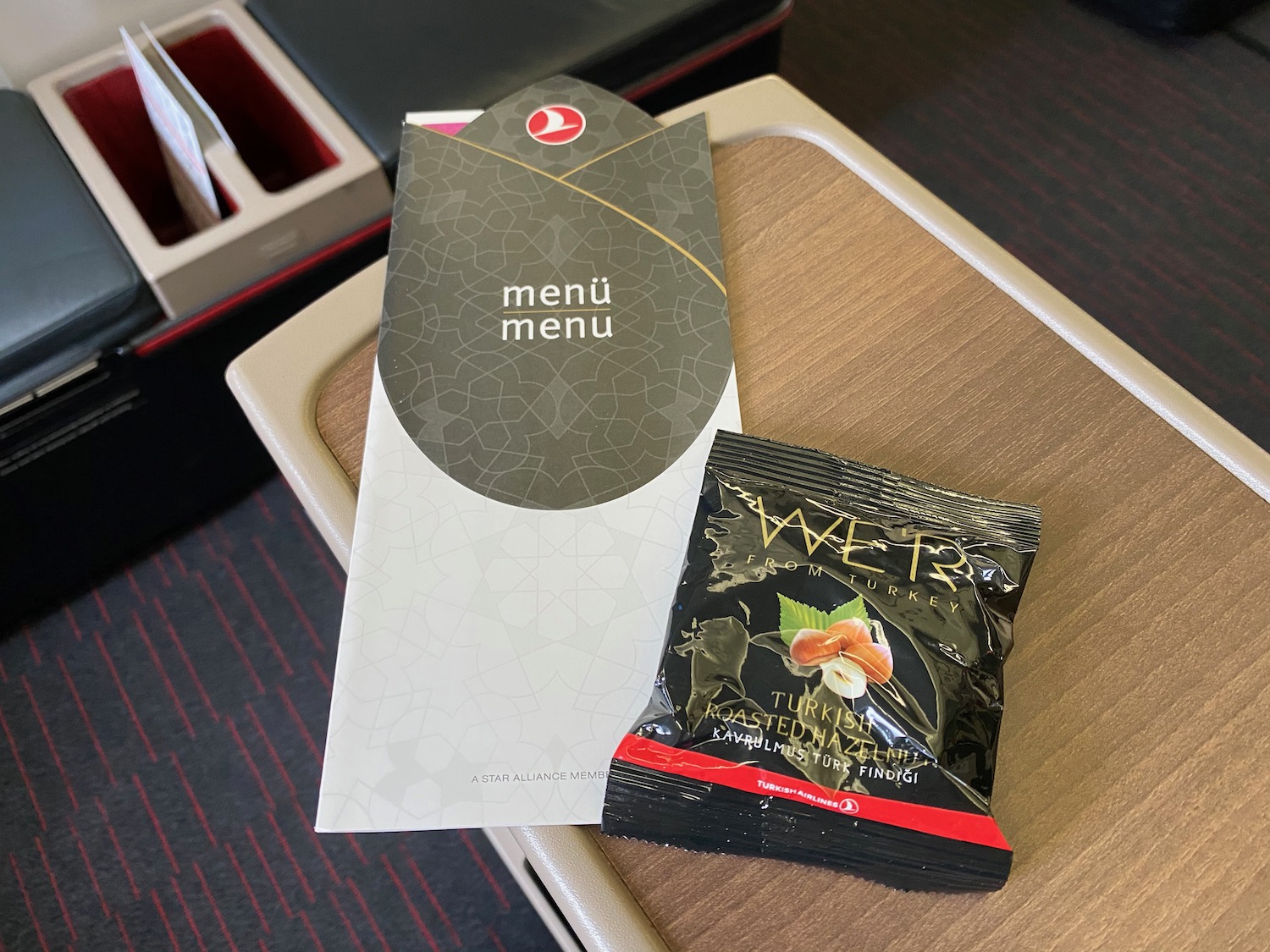 a menu and a packet on a table