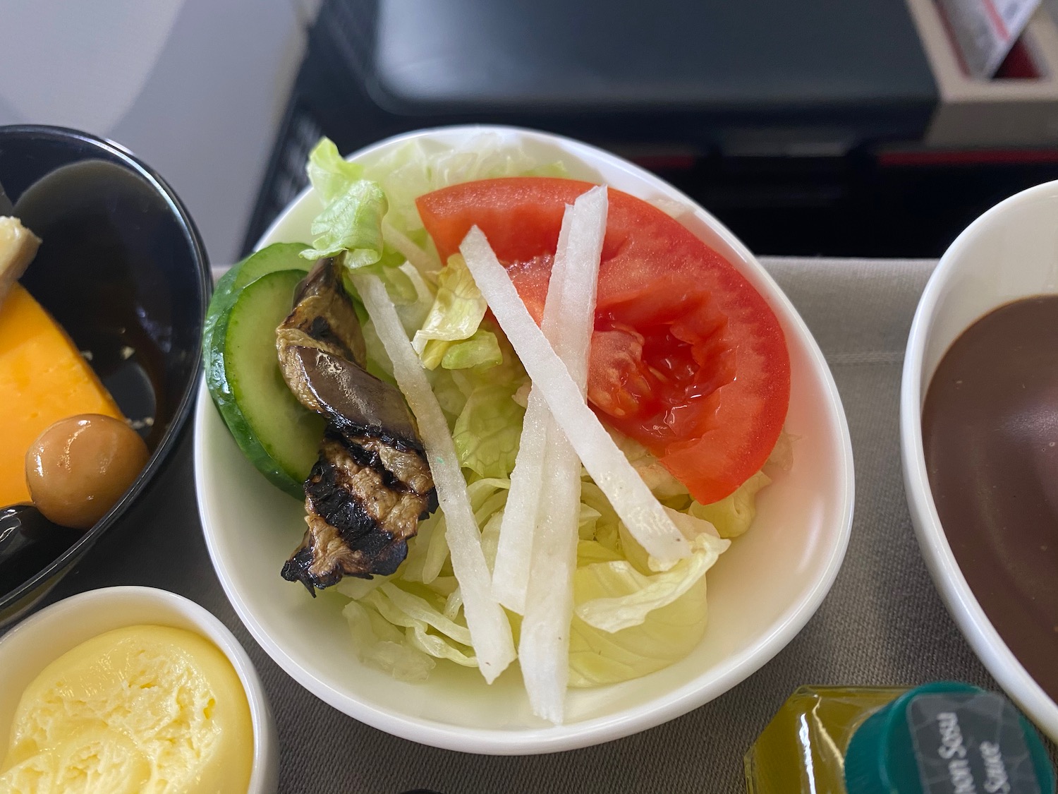 a bowl of salad with vegetables and meat