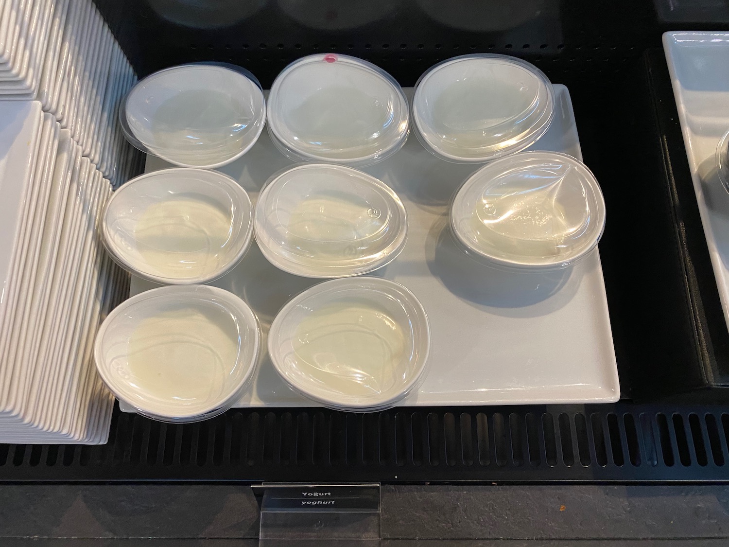 a group of white bowls on a white plate