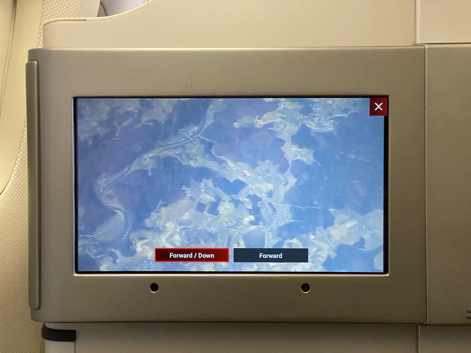 a screen with a blue sky and red text