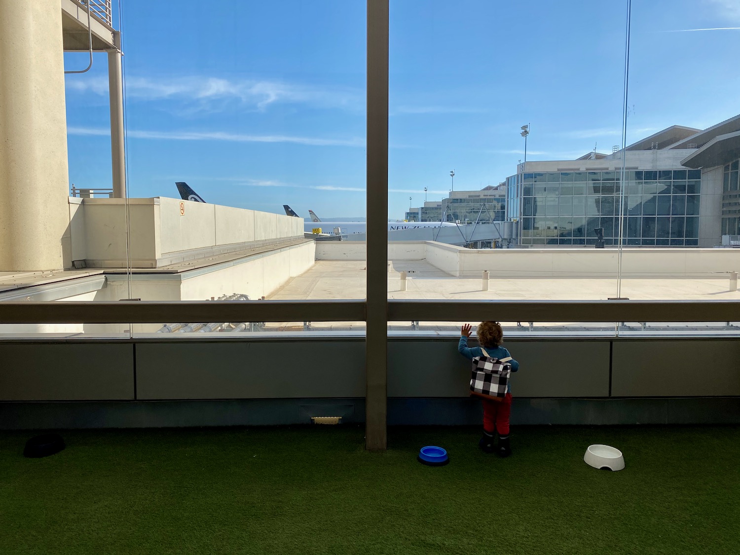 a child standing near a window