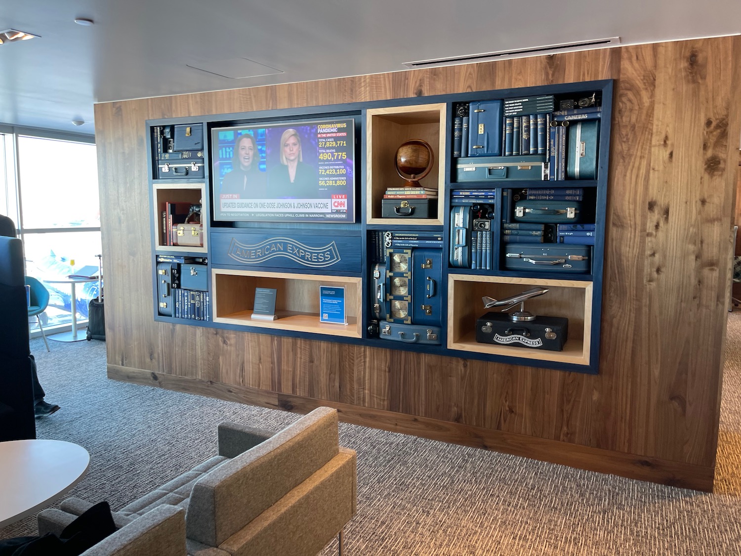 a wall with a tv and shelves