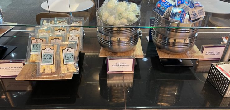 a glass display case with food items on it