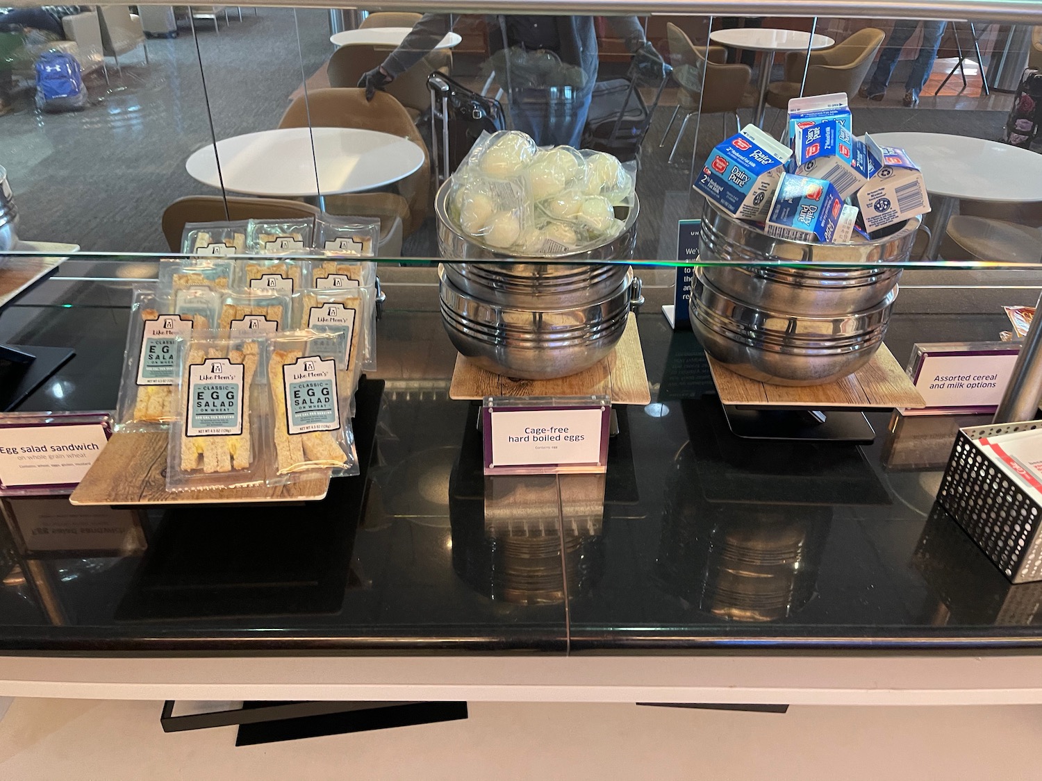 a glass display case with food items on it