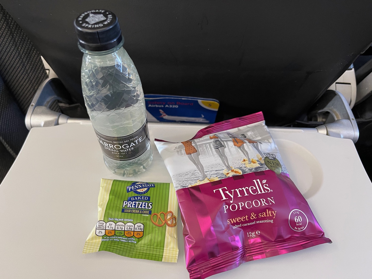 a bottle of water and snacks on a table