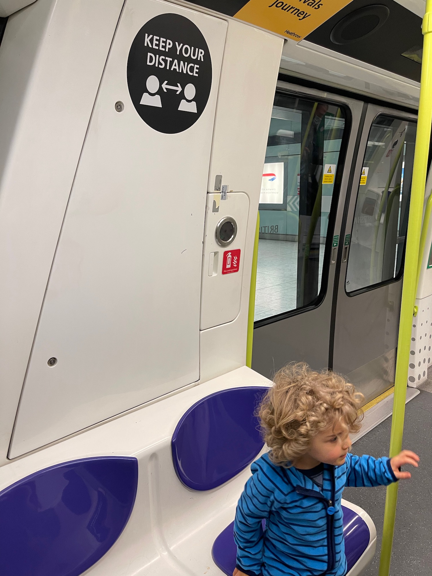 a child standing in a subway