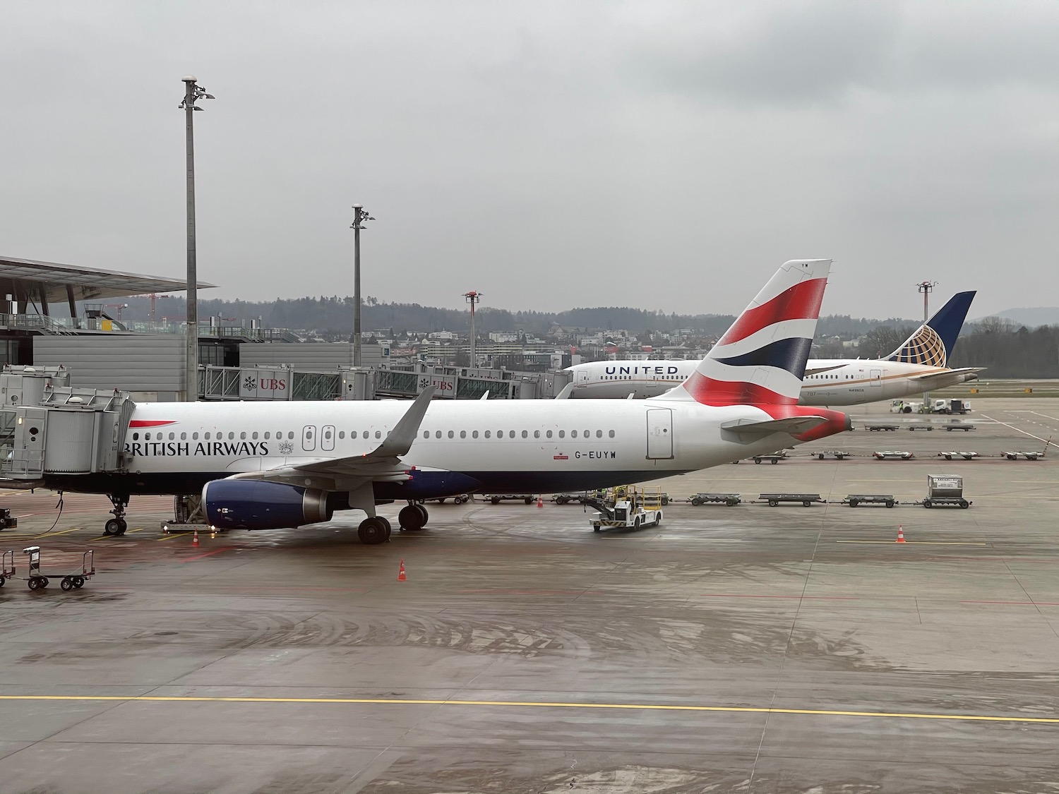 a group of airplanes parked at an airport