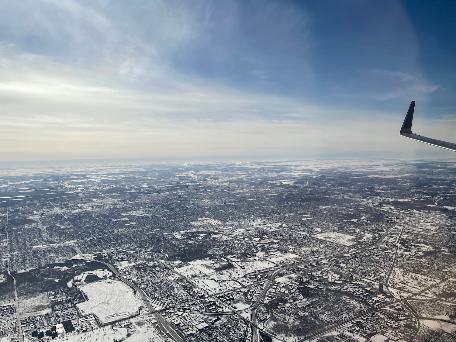 an aerial view of a snowy city