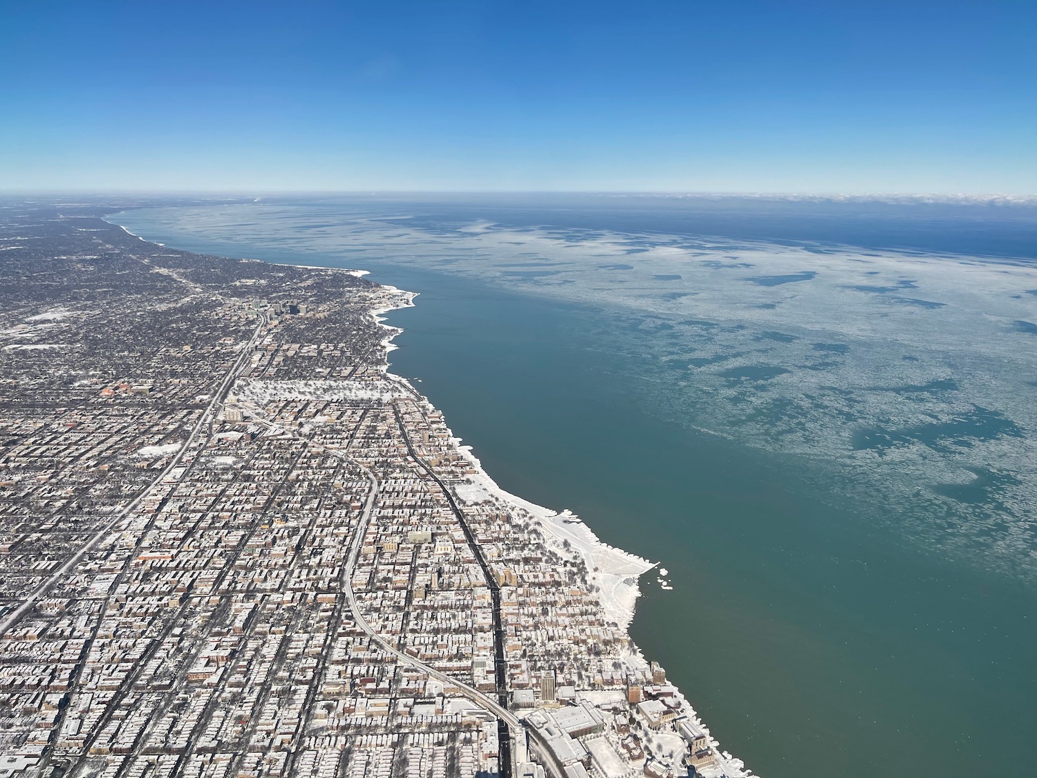 an aerial view of a city and water