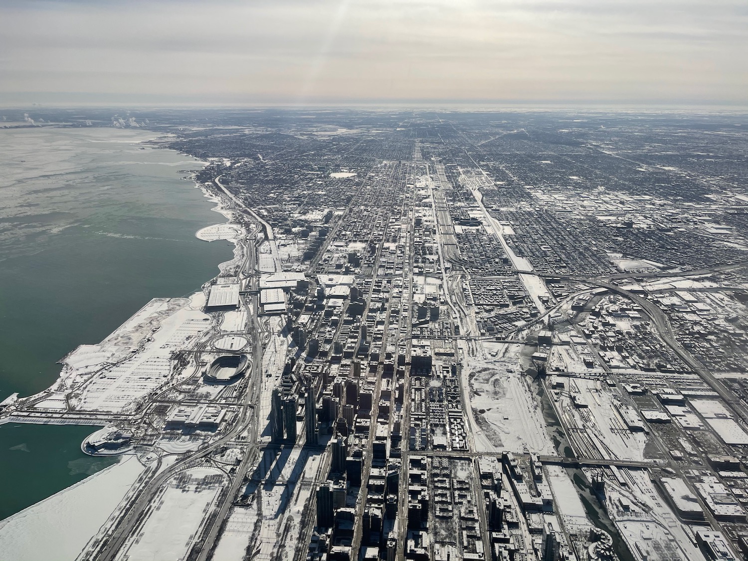 an aerial view of a city with snow