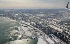 an aerial view of a city and water