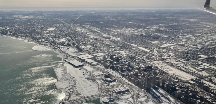 an aerial view of a city and water