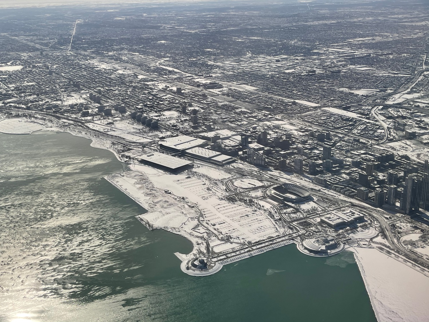 an aerial view of a city with snow