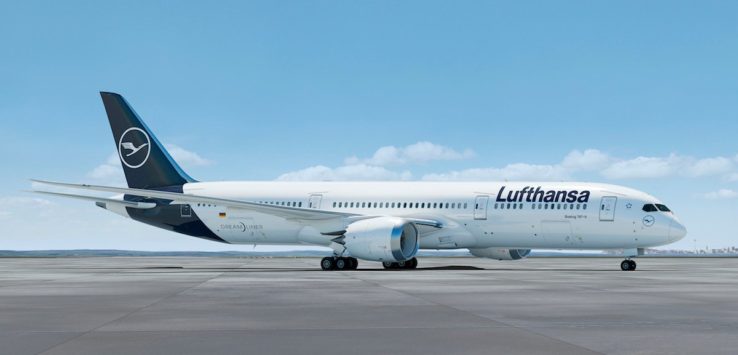 a white airplane on a runway