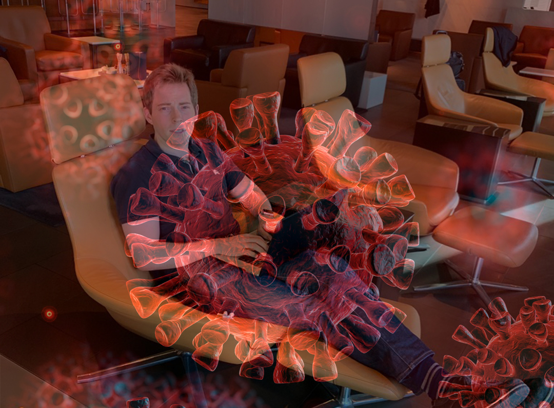 a man sitting in a chair with a virus