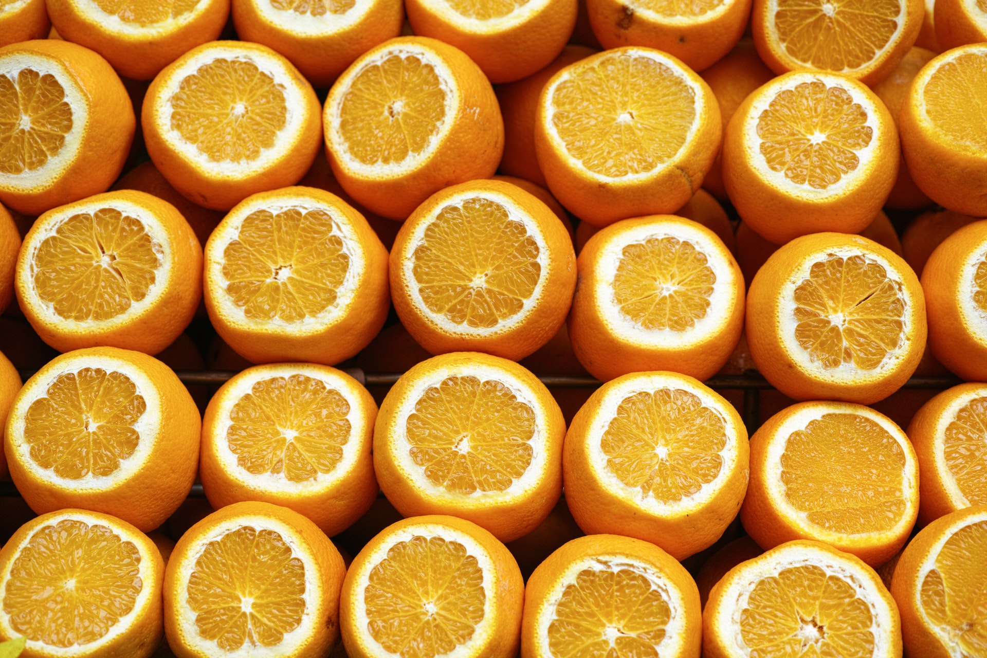 a group of oranges cut in half