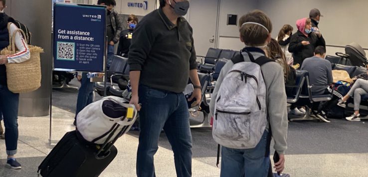 a man and a boy wearing face masks