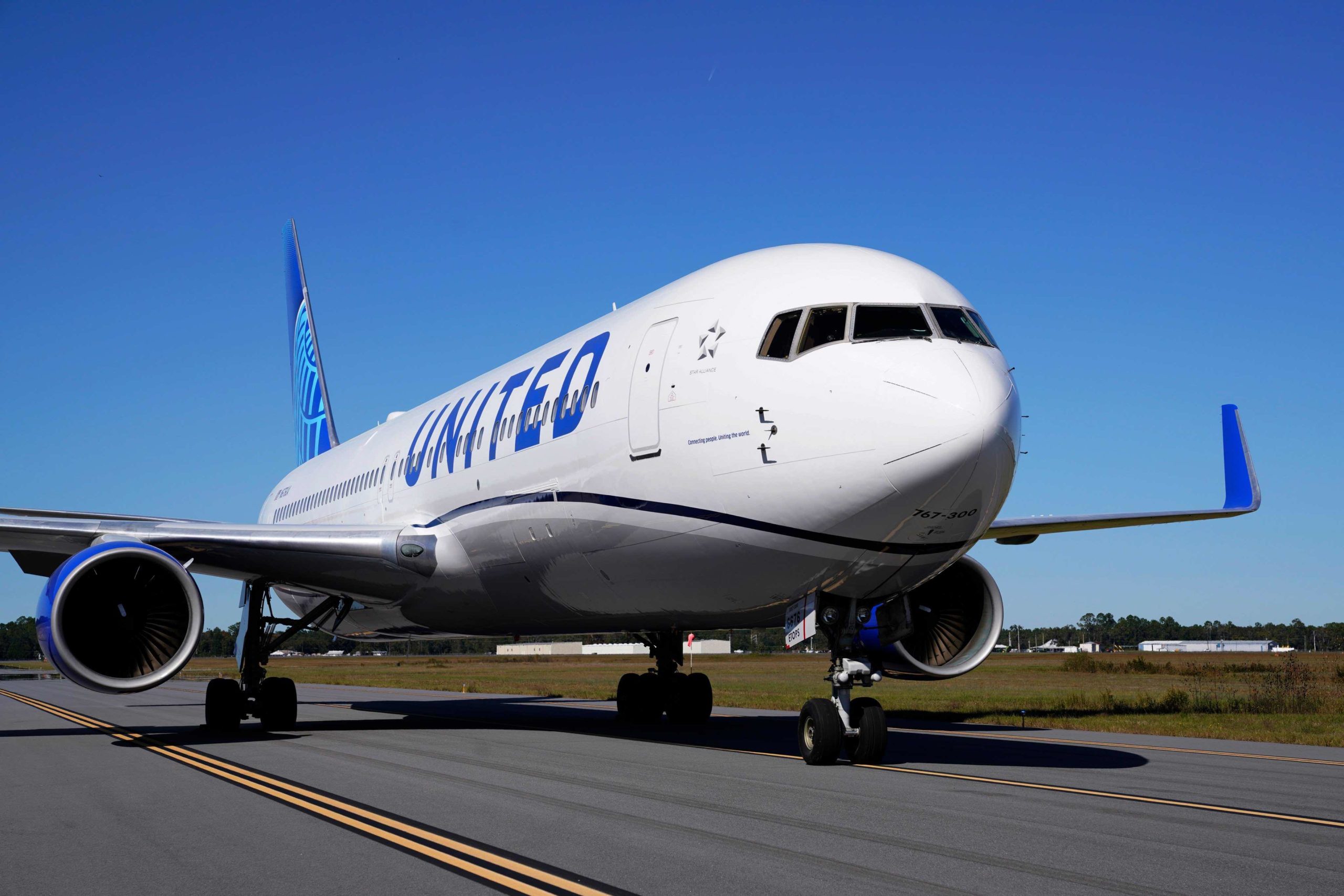 a white airplane on a runway